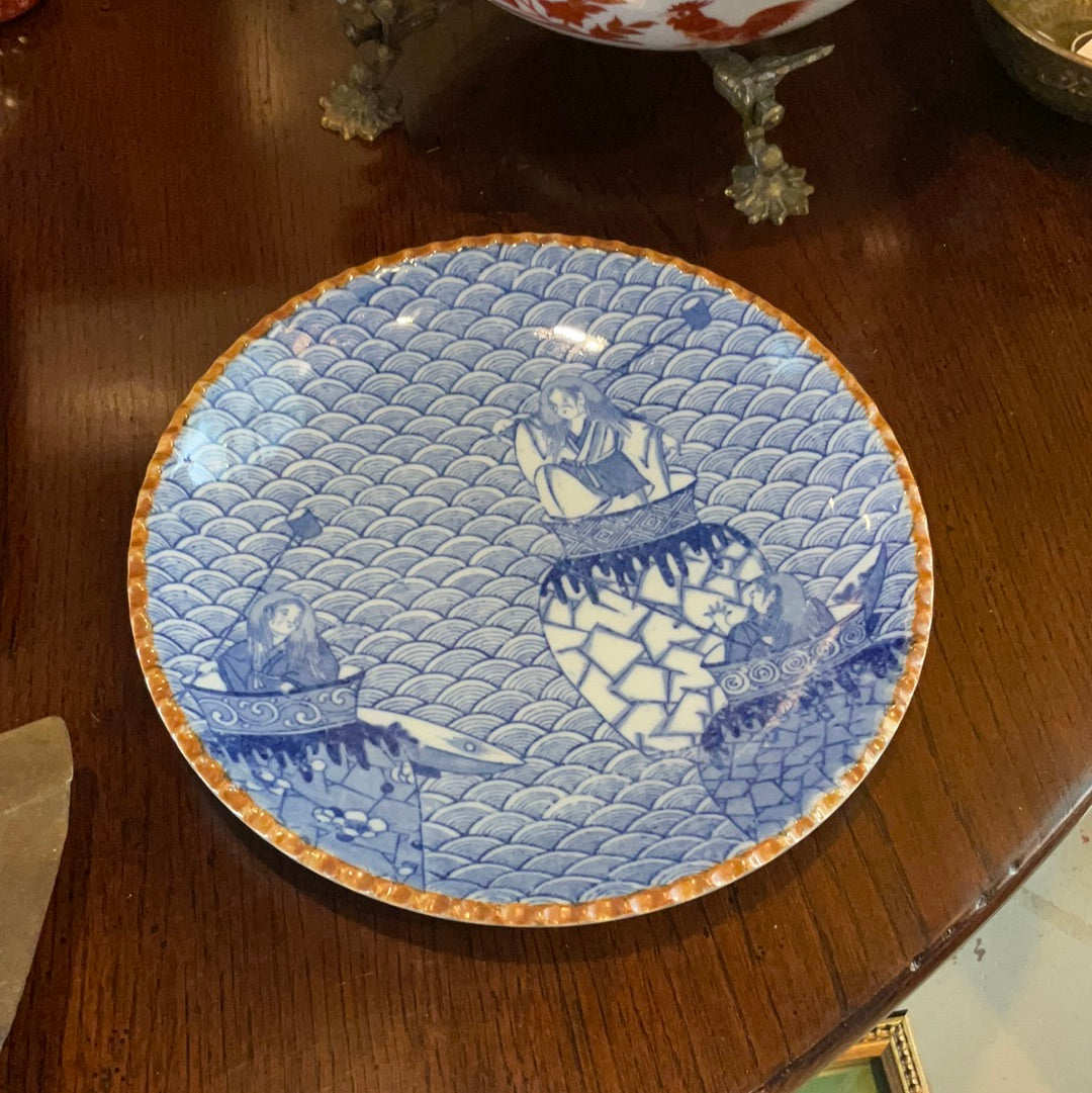 Blue and white plate with brown trim